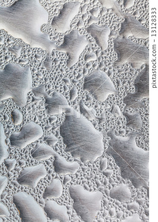 Metal surface covered in water drops. 13128333