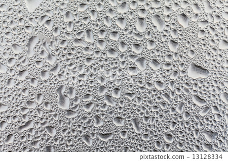 Metal surface covered in water drops. 13128334
