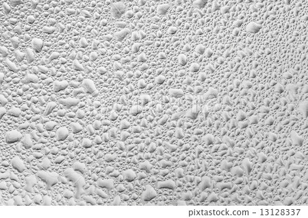 Metal surface covered in water drops. 13128337