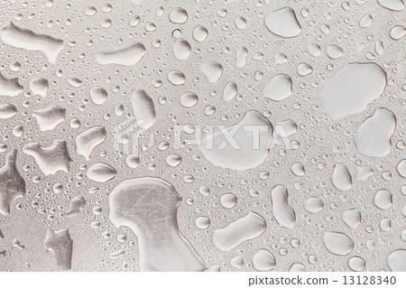 Metal surface covered in water drops. 13128340