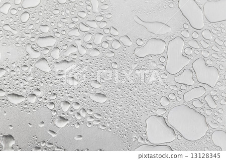 Metal surface covered in water drops. 13128345