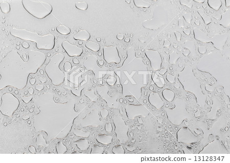 Metal surface covered in water drops. 13128347