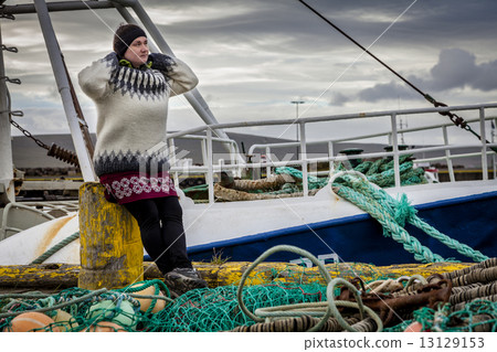 Woman and fishing ship 13129153