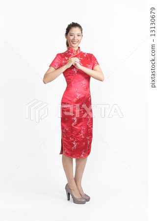 One young chinese woman in Cheongsam wishing you abundance of wealth in isolated white background 13130679