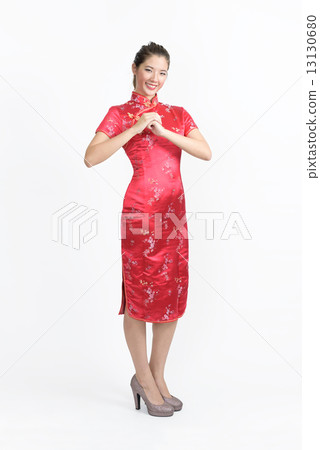 One young chinese woman in Cheongsam wishing you gong xi fa cai in isolated white background One young chinese woman in Cheongsam wishing you gong xi fa cai in isolated white background 13130680