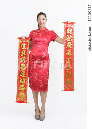 Chinese woman in Cheongsam with chun lian wishing good business fortune isolated white background  13130815