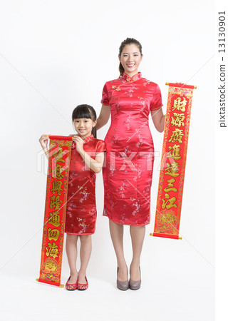 Mother daughter in Cheongsam with banners wishing good business fortune isolated white background  13130901