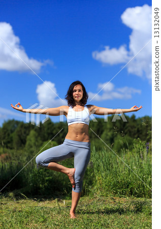 Young woman doing yoga outdoor 13132049