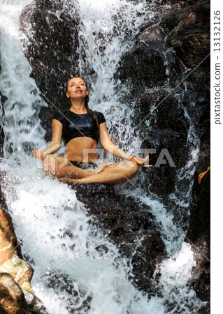 Young Happy Woman Doing Meditating in Lotus Position 13132126