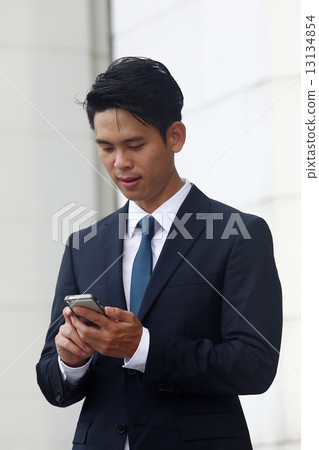 Asian men who mess with cell phones 13134854