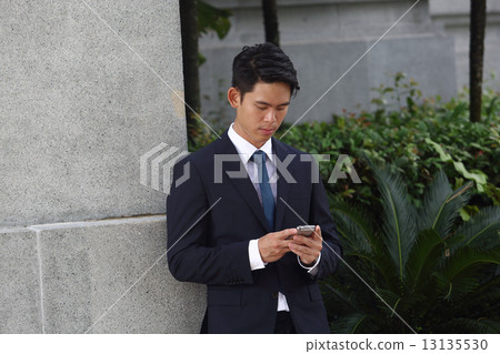 Asian men who mess with cell phones 13135530