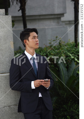 Asian men who mess with cell phones 13135552