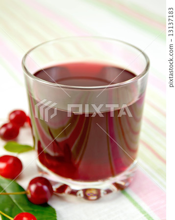Compote cherry in glass on fabric 13137183