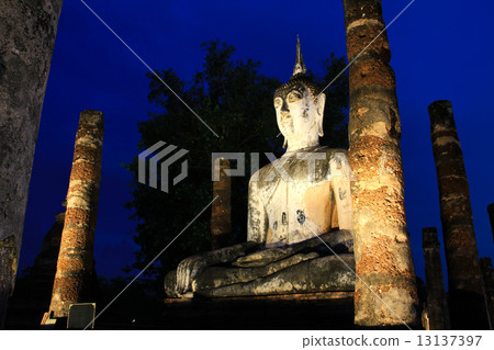 Ancient buddha statue at twilight, Wat Mahathat in Sukhothai His 13137397