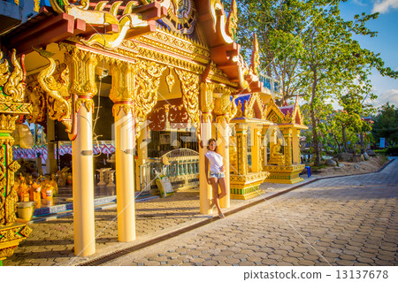 Tourist girl posing near the temple in Thailand Tourist girl posing near the temple in Thailand 13137678
