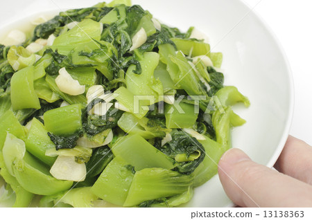 Serving a dish of vegetable Serving a dish of vegetable 13138363