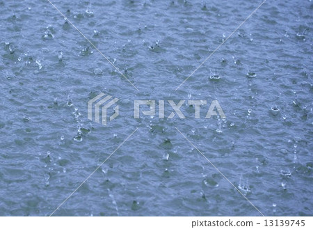 The surface of the pond where heavy rain falls The surface of the pond where heavy rain falls 13139745