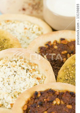 Lahm Bi Ajin, Zaatar and Cheese Manakish - Flatbreads topped with minced lamb, cheese and zaatar.  13139893