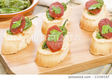 Chorizo & Padron Peppers Pinchos - Spanish tapas with crusty bread, spicy sausage and fried peppers 13140197