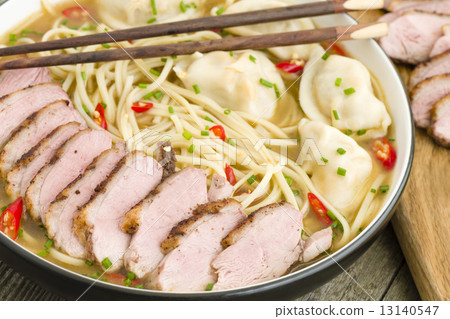 Wonton Noodle Soup - Chinese noodle soup with dumplings and sliced duck breast. 13140547