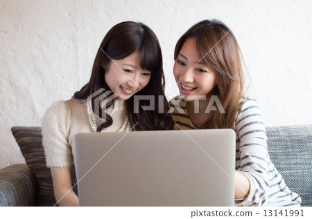 Woman dealing with personal computer Two person view out of composition 13141991