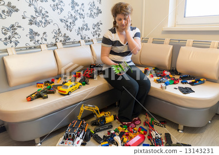 Mom and Children toys on floor in the room Mom and Children toys on floor in the room 13143231