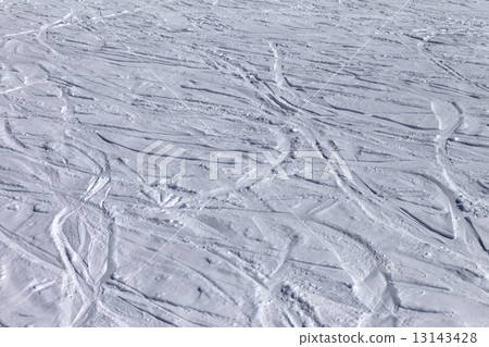 Ski slope with trace from ski and snowboards 13143428