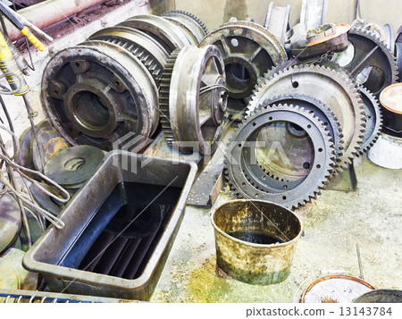gears of disassembled engine in workshop 13143784