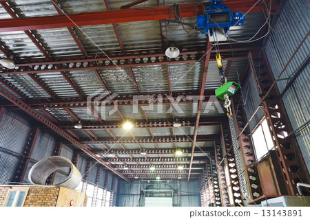 hoist with overhead crane and scales in warehouse 13143891