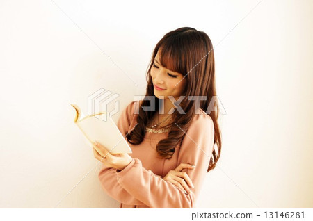 Young woman reading a book Young woman reading a book 13146281