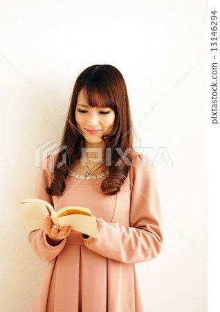 Young woman reading a book Young woman reading a book 13146294