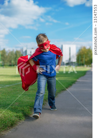 Superhero running forward and jumping 13147553