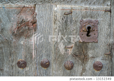 Old run-down wooden door and iron lock 13151549