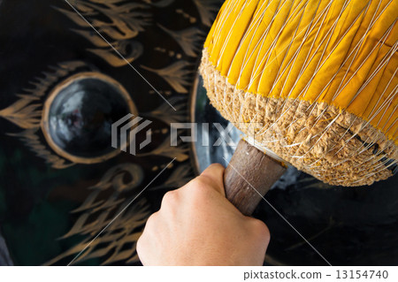 image of Hand hit big gong in temple  13154740
