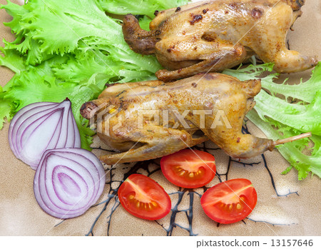 woodcocks fried with vegetables on a plate close-up 13157646