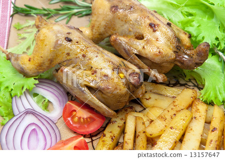 roasted carcass woodcock with potatoes and vegetables on a plate 13157647