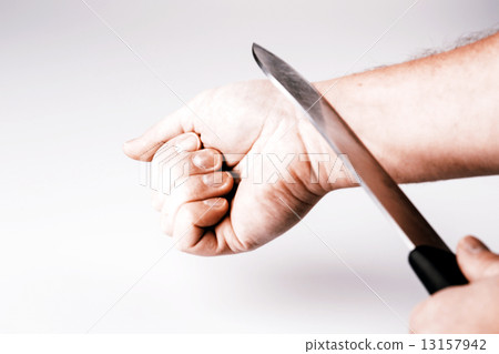 Close up of a suicidal man hand on isolated white background Close up of a suicidal man hand on isolated white background 13157942