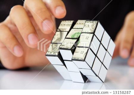 hand holding a rubik's cube,money concept  13158287