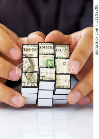hand holding a rubik's cube,money concept  13158289