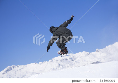 Extreme Snowboarder jumping 13160005