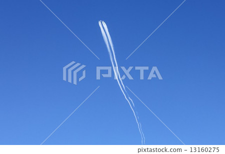 An airplane quietly advancing to flow far above the sky while drawing an airborne cloud 13160275