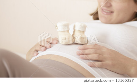 Pregnant woman with booties 13160357