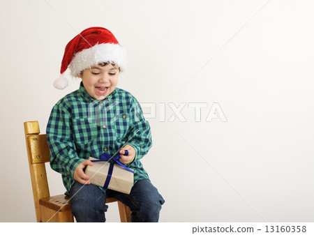 boy with a Christmas present 13160358