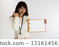 A woman holding a board (Guts pose) 13161456