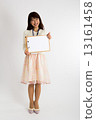 A woman holding a board (front) 13161458