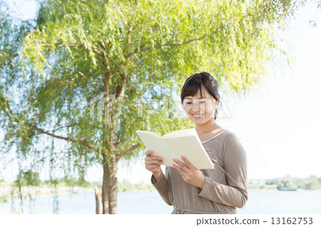 A woman reading A woman reading 13162753
