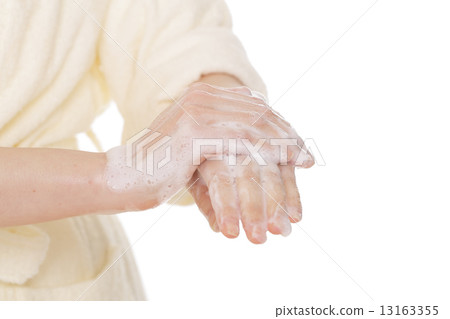 Women wash their hands 13163355