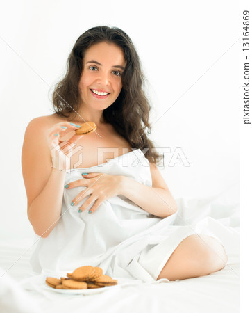 woman eating sweet chocolate chip cookies 13164869