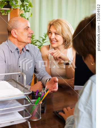 Pensioners talking with manager 13164912