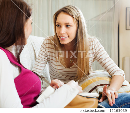 two girls gossiping 13165089